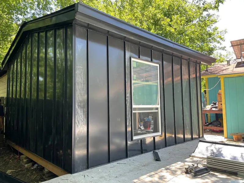 Black standing seam metal wall panels for Roof Inspection in Woodland